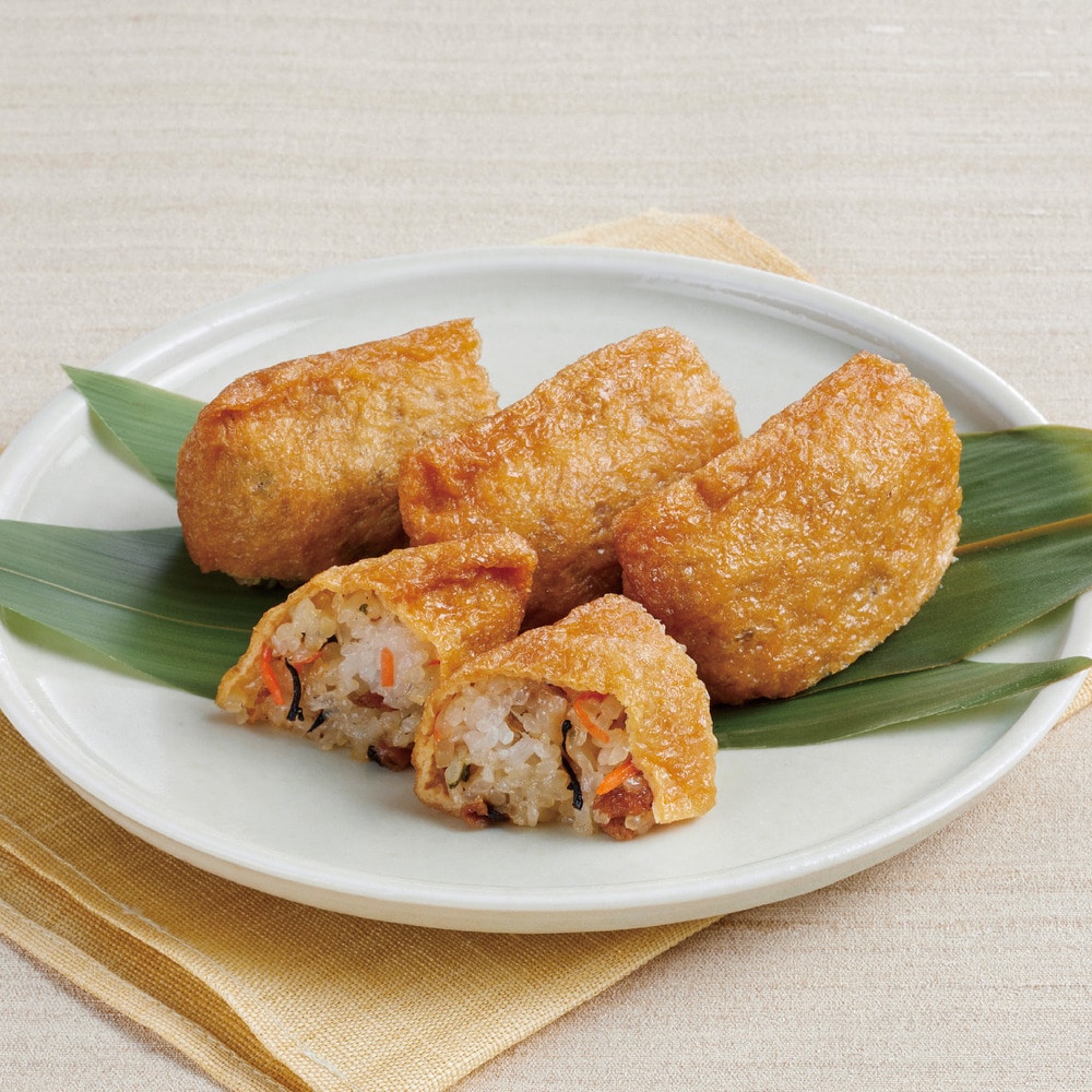 新潟県産もち米に七目の国産食材を混ぜ込んだ、具沢山な手作りいなり。朝から常温解凍すればお昼には食べ頃に。