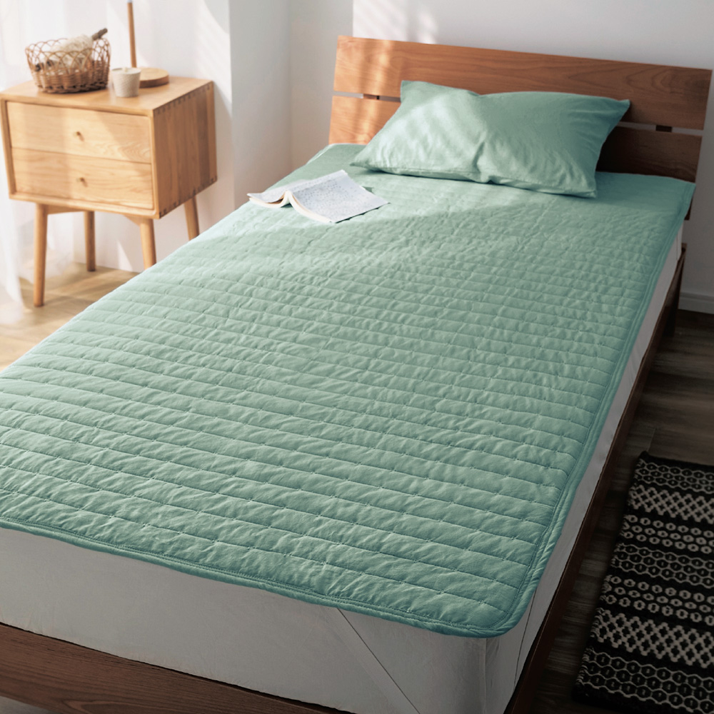 洗いをかけた綿素材の敷きパッド