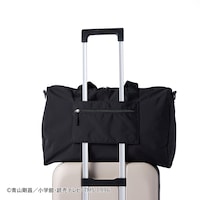 キャリーケースのバーに固定して運べます。
